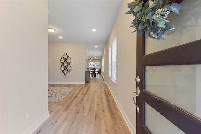 corridor featuring light hardwood / wood-style floors