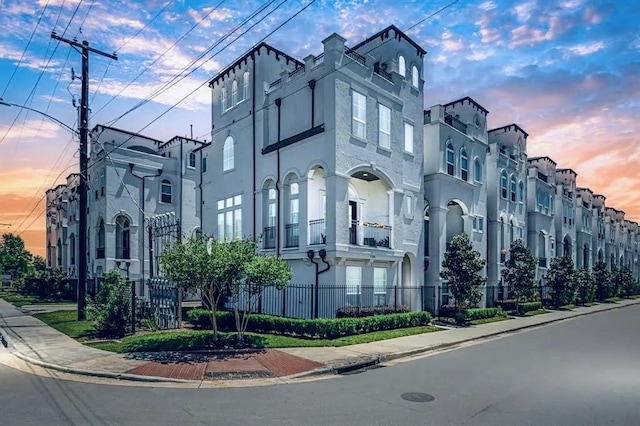 view of outdoor building at dusk