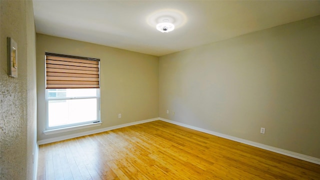 2300 Augusta Dr Unit 22, Houston, TX 77057 - spare room featuring baseboards and light wood-style flooring
