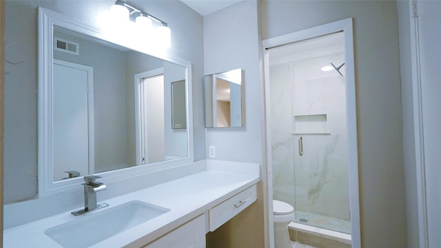 2300 Augusta Dr Unit 22, Houston, TX 77057 - bathroom featuring a marble finish shower, vanity, toilet, and visible vents