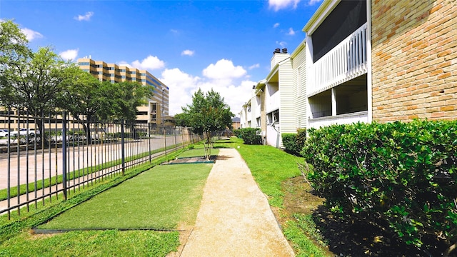 2300 Augusta Dr Unit 22, Houston, TX 77057 - view of property's community with a lawn and fence