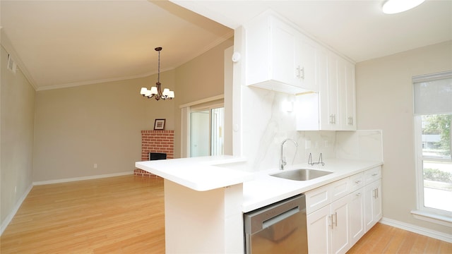 2300 Augusta Dr Unit 22, Houston, TX 77057 - kitchen with dishwasher, a sink, light wood-style flooring, crown molding, and baseboards