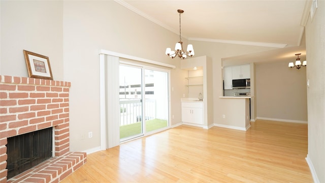 2300 Augusta Dr Unit 22, Houston, TX 77057 - unfurnished living room featuring a chandelier, light wood-type flooring, crown molding, baseboards, and high vaulted ceiling