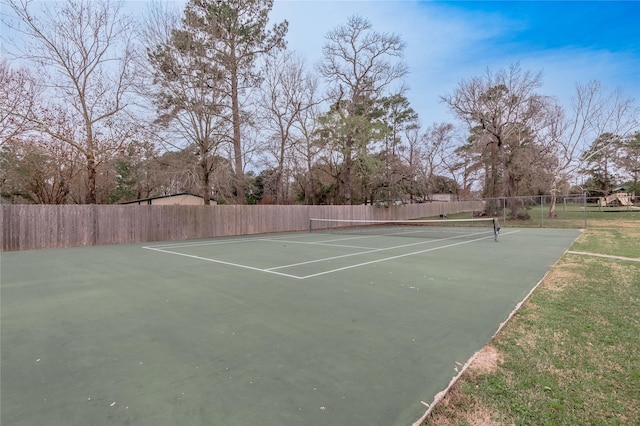 view of sport court with fence