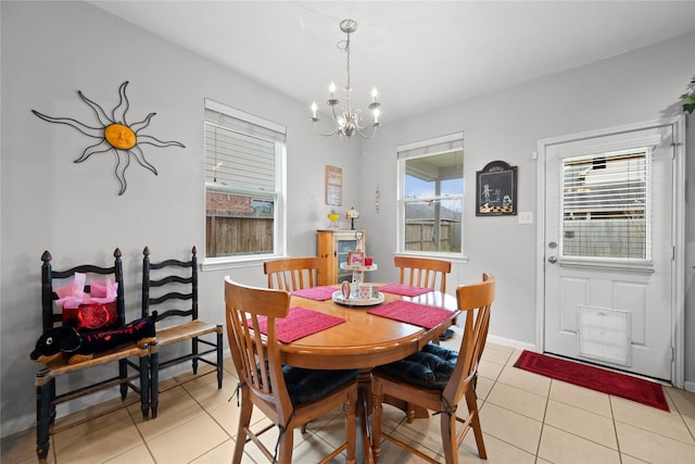 21324 Village Crossing Ln, Porter, TX 77365 - dining room featuring light tile patterned floors, a chandelier, and baseboards