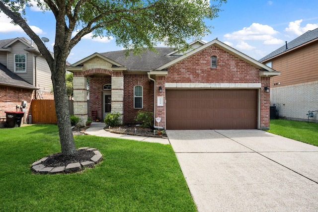 21324 Village Crossing Ln, Porter, TX 77365 - view of front facade with brick siding, a garage, concrete driveway, and roof with shingles