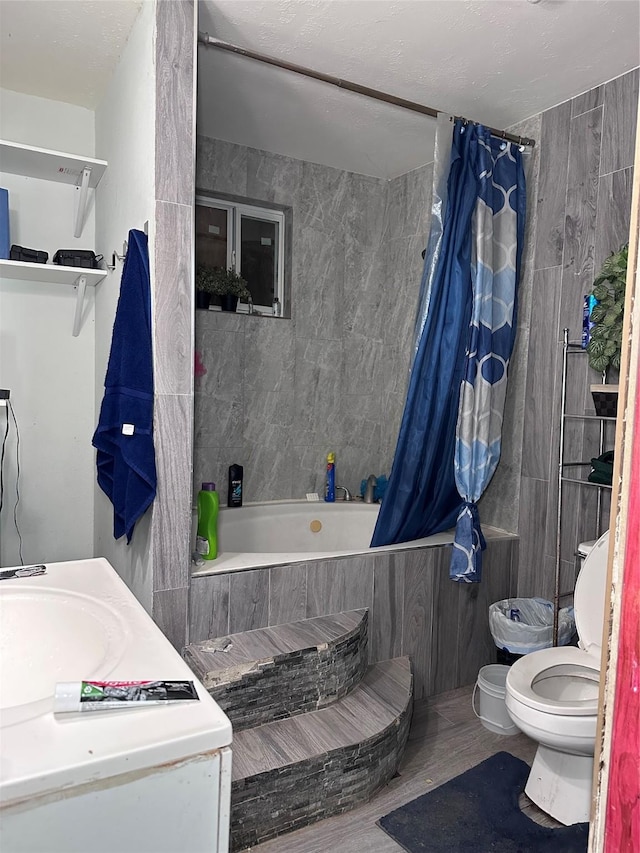 full bath with toilet, tile walls, and tiled shower / bath combo