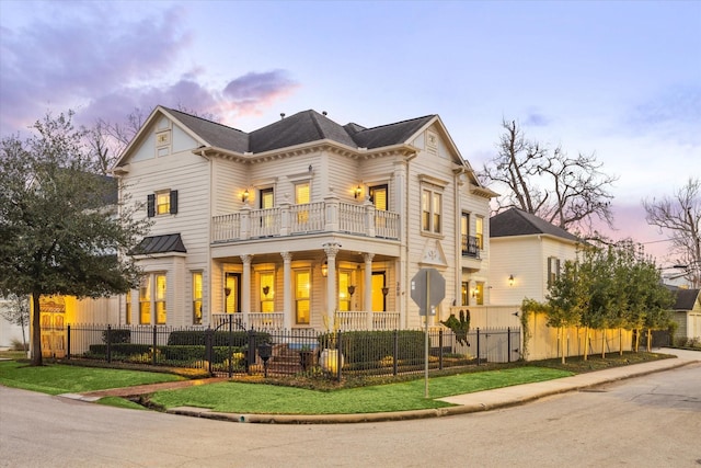 view of front of home with a balcony and covered porch