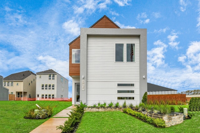 contemporary house with a front lawn