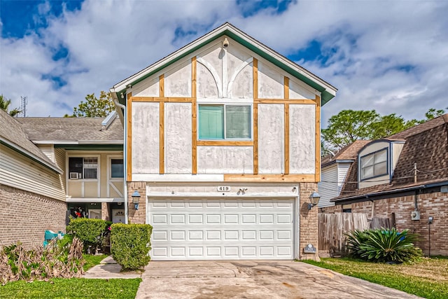 tudor-style house with a garage