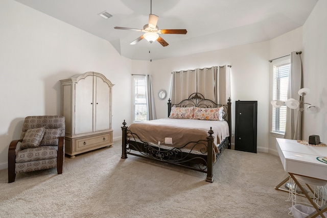 bedroom with light colored carpet, baseboards, a ceiling fan, and visible vents