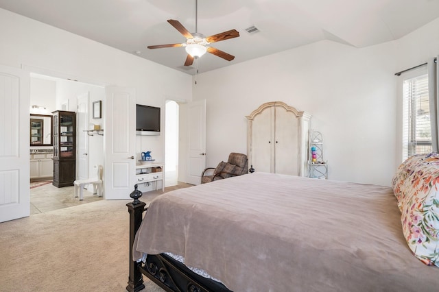 9518 Brannok Ln, Tomball, TX 77375 - bedroom with light colored carpet, connected bathroom, and a ceiling fan