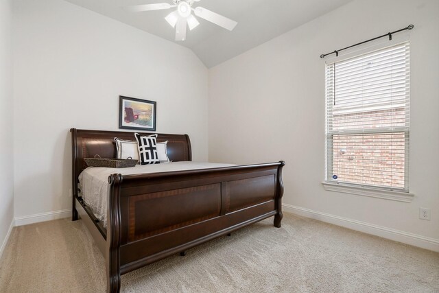 9518 Brannok Ln, Tomball, TX 77375 - bedroom with carpet, baseboards, vaulted ceiling, and a ceiling fan