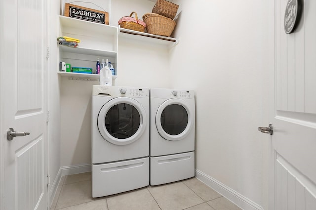 9518 Brannok Ln, Tomball, TX 77375 - laundry area with separate washer and dryer, light tile patterned floors, and baseboards