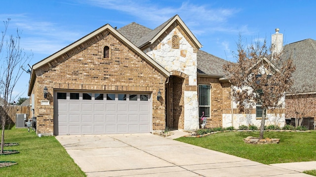 view of front facade featuring brick siding, a front yard, cooling unit, and driveway