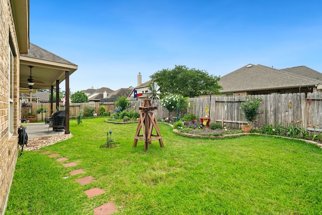 9518 Brannok Ln, Tomball, TX 77375 - view of yard featuring ceiling fan and a patio