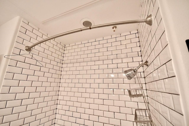 full bathroom with tiled shower