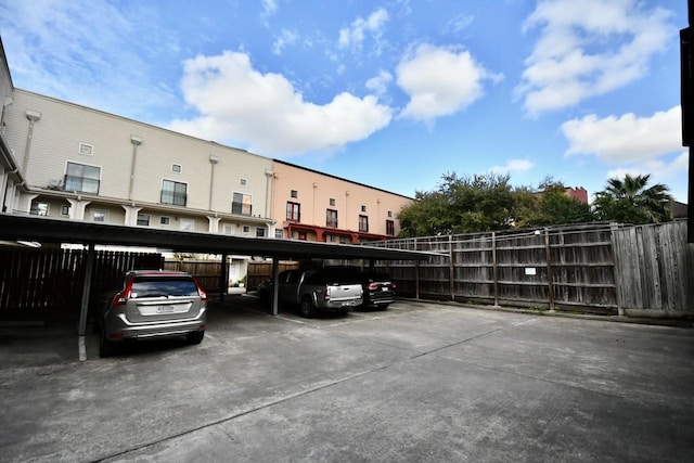 covered parking lot with fence