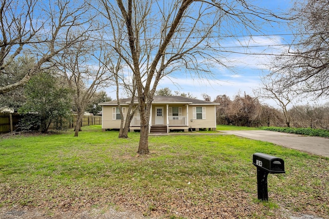 view of front of house with a front lawn and a porch