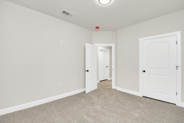 unfurnished bedroom with light carpet