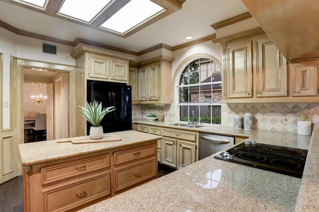 kitchen featuring tasteful backsplash, crown molding, light stone countertops, and black appliances