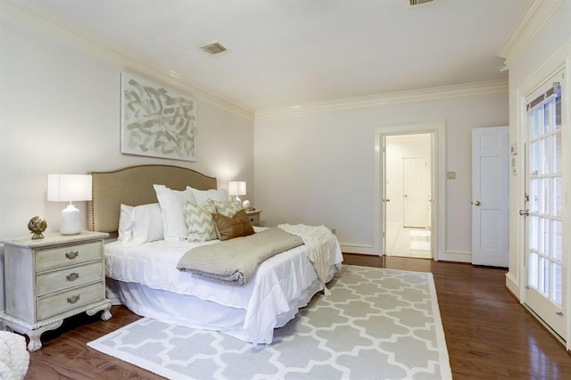 bedroom with crown molding and dark wood-type flooring