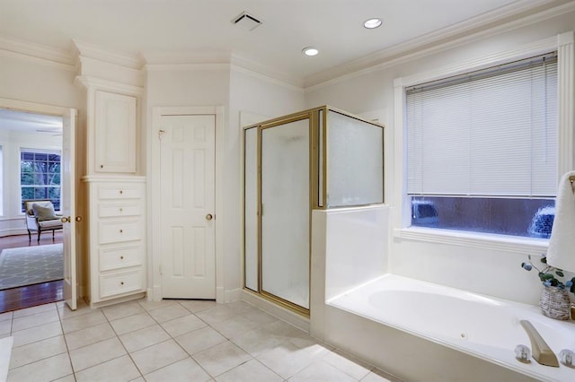 bathroom with tile patterned flooring, crown molding, and plus walk in shower