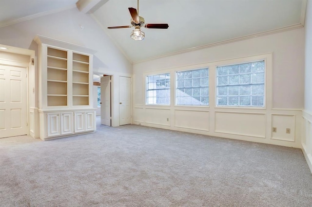 unfurnished living room featuring light carpet, crown molding, beam ceiling, and ceiling fan