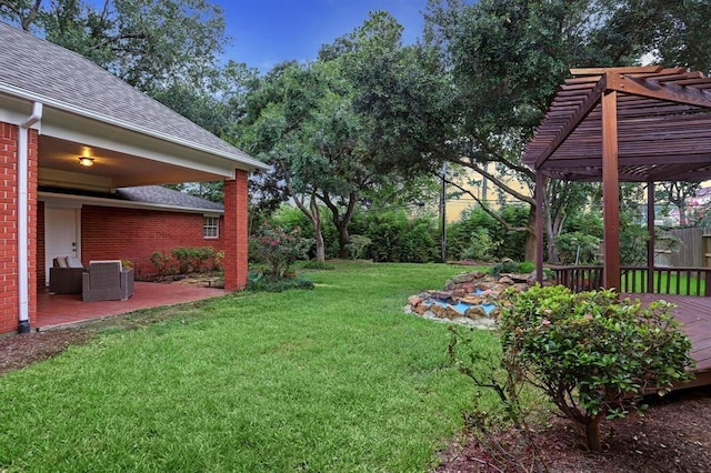 view of yard featuring a wooden deck, central AC, and a pergola