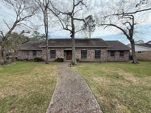 ranch-style home featuring a front yard