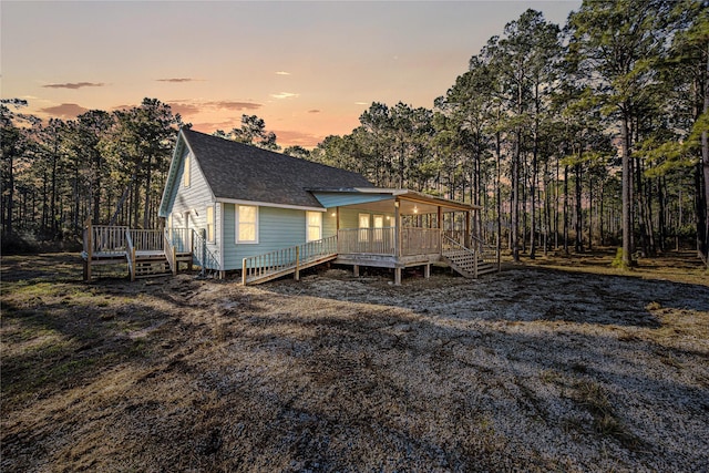 view of front of property with a wooden deck