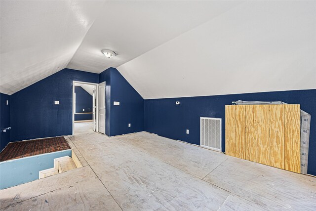 bonus room with vaulted ceiling