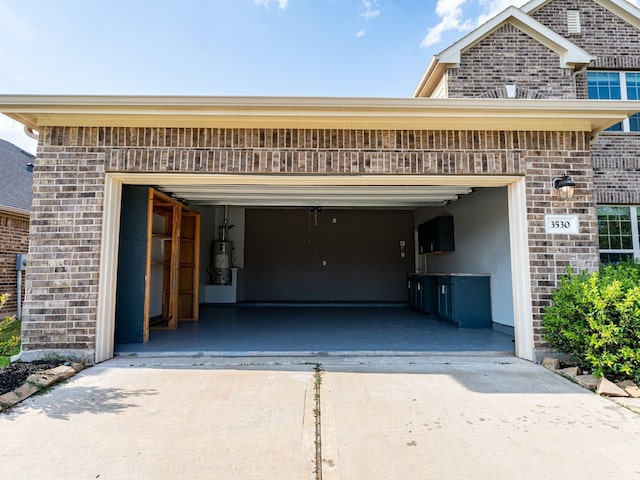 garage featuring gas water heater