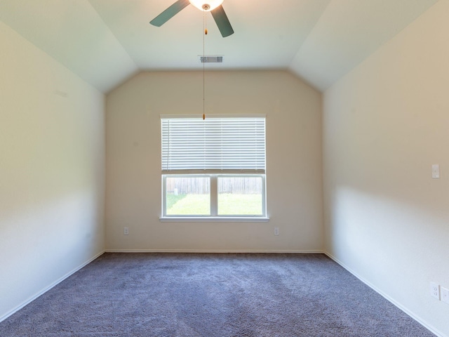 carpeted empty room featuring ceiling fan and lofted ceiling