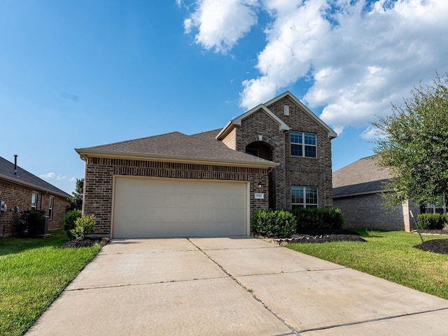 view of front facade featuring a garage and a front lawn