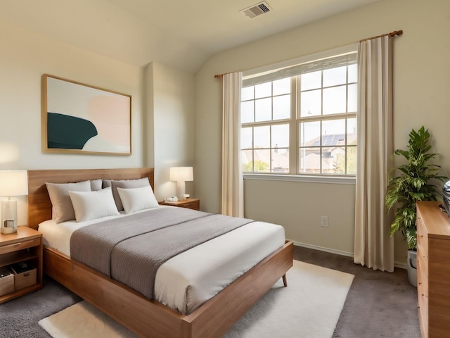 carpeted bedroom featuring vaulted ceiling