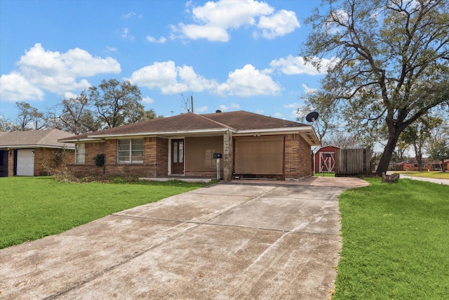 ranch-style home with a garage, brick siding, concrete driveway, and a front yard