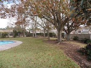 view of yard featuring fence and a fenced in pool