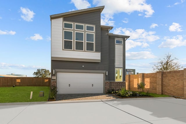 view of property exterior featuring brick siding, a yard, an attached garage, fence, and driveway