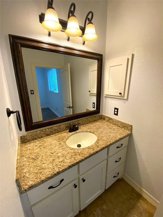 bathroom featuring tile patterned flooring and vanity