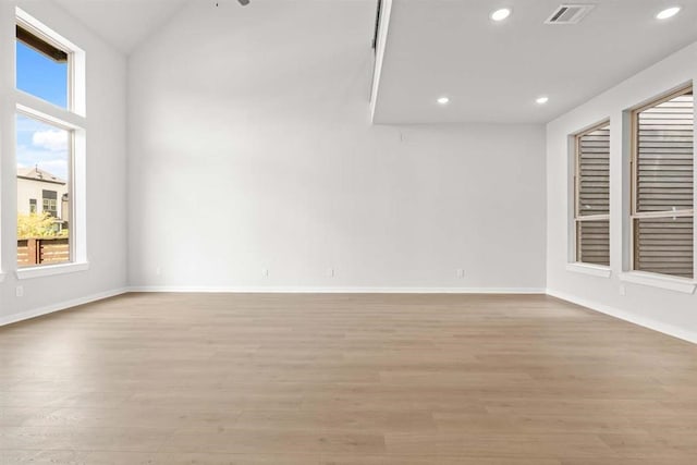 unfurnished room with a wealth of natural light and light wood-type flooring