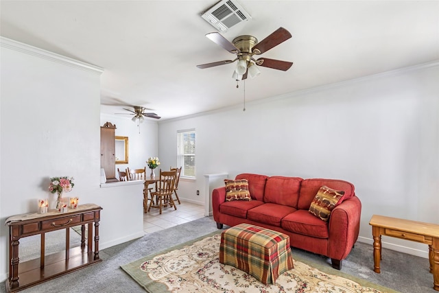 carpeted living room featuring ornamental molding and ceiling fan