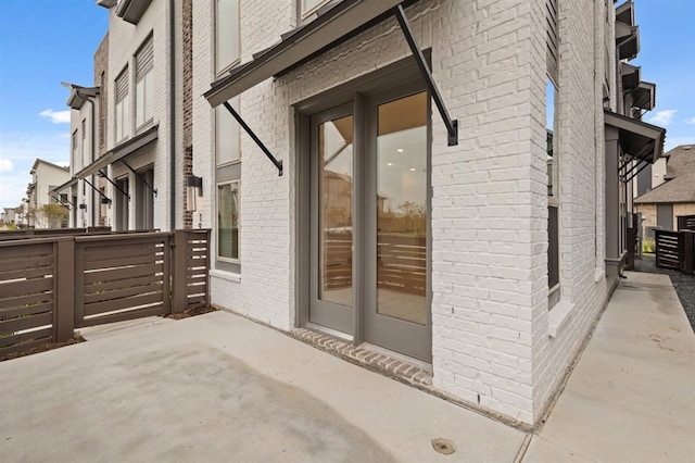 doorway to property with a patio area