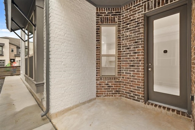 doorway to property with a patio area