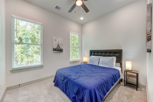 carpeted bedroom with ceiling fan