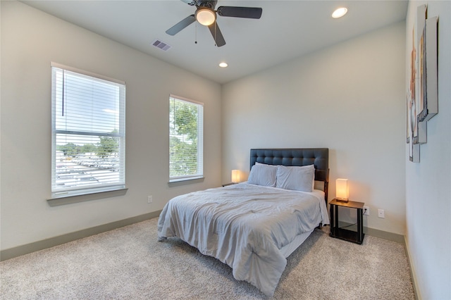 carpeted bedroom featuring ceiling fan