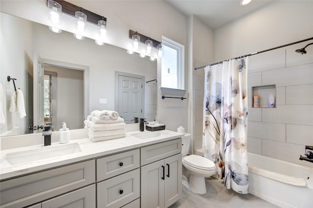 full bathroom featuring vanity, toilet, tile patterned flooring, and shower / tub combo