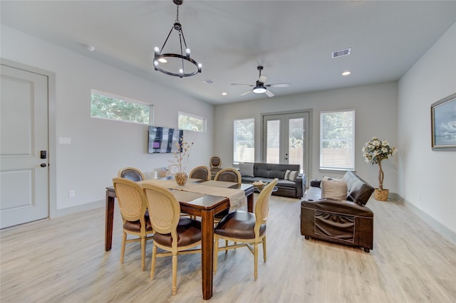 dining room featuring french doors and light hardwood / wood-style floors