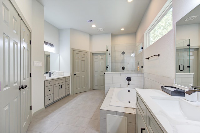 bathroom featuring vanity, tile patterned flooring, and independent shower and bath