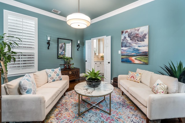 living room featuring ornamental molding and wood-type flooring